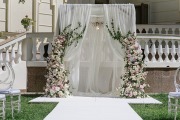 Wedding ceremony in the summer on a sunny day. Luxury wedding decor