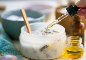 Spa still life with essential oil and homemade salt scrub