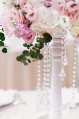 The lens chains complement the flower composition on the wedding table