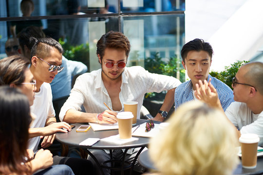 asian college students meeting outdoors