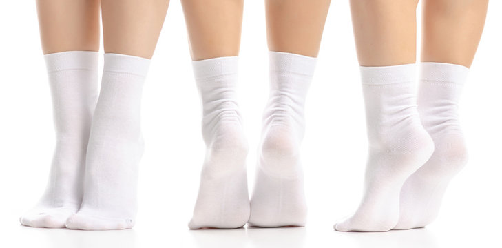 Set female legs in white socks on white background isolation