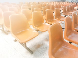 Fototapeta premium Close-up Orange Spectators seats at Office with copy space