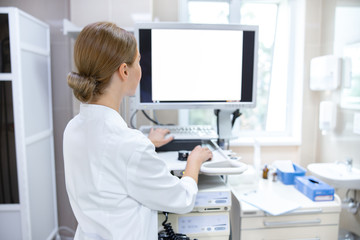Woman in clinic office with digital equipment stock photo