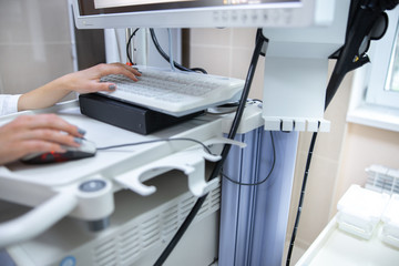 Physician using computer for examination stock photo