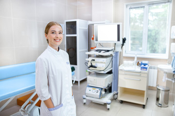 Happy woman enjoying work in clinic stock photo