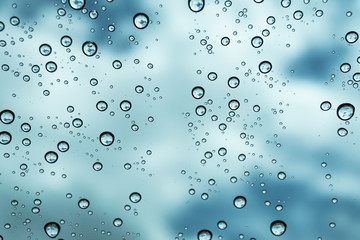 Rain on the window, natural skin of the rain The natural form of rainwater on a sky background.