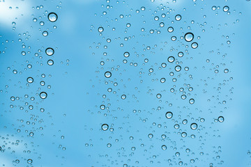 Rain on the window, natural skin of the rain The natural form of rainwater on a sky background.