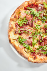 Tasty parma ham and artichoke pizza top view