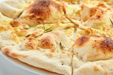 Delicious fried focaccia with rosemary closeup