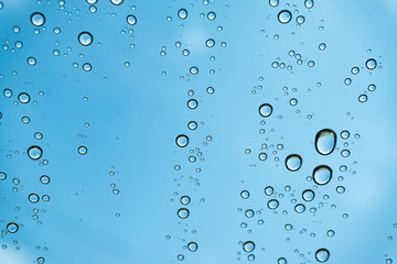 Rain on the window, natural skin of the rain The natural form of rainwater on a sky background.