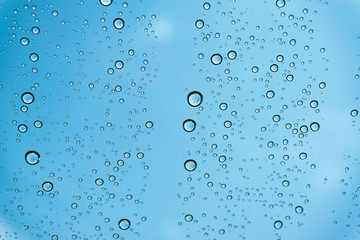 Rain on the window, natural skin of the rain The natural form of rainwater on a sky background.