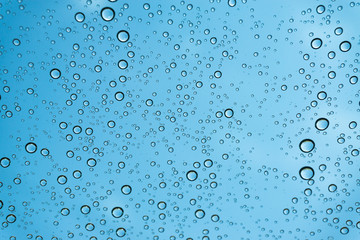 Rain on the window, natural skin of the rain The natural form of rainwater on a sky background.