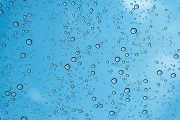 Rain on the window, natural skin of the rain The natural form of rainwater on a sky background.