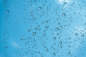 Rain on the window, natural skin of the rain The natural form of rainwater on a sky background.