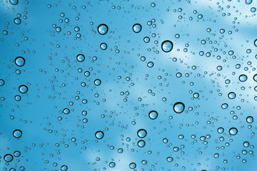 Rain on the window, natural skin of the rain The natural form of rainwater on a sky background.