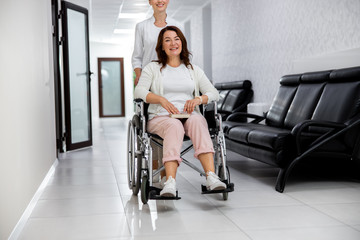 Fototapeta na wymiar Woman on wheelchair going to hospital stock photo