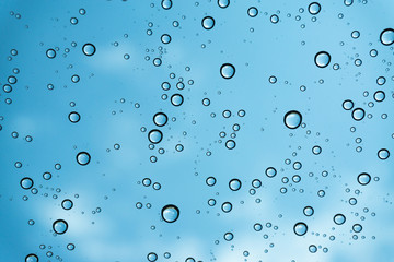 Rain on the window, natural skin of the rain The natural form of rainwater on a sky background.