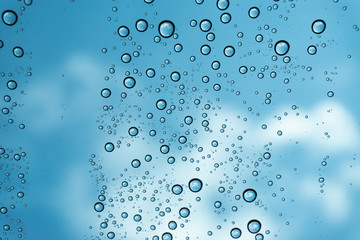 Rain on the window, natural skin of the rain The natural form of rainwater on a sky background.