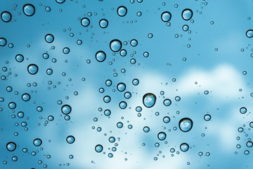 Rain on the window, natural skin of the rain The natural form of rainwater on a sky background.