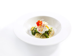 Red king crab with spinach and pear top view