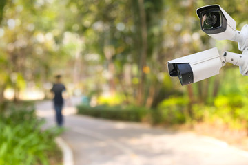 Outdoor and waterproof ip security surveillance video camera in a public park.
