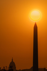 Fototapeta premium Sun Rises Over the US Capitol and Washington Monument