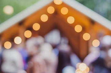 Blurred background. Blurred background on the street with lights-lanterns. Street festival.