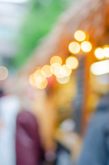 Blurred background. Blurred background on the street with lights-lanterns. Street festival.