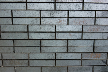 wall made of grey bricks. For texture or background