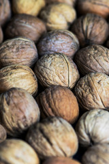 whole unpeeled brown nuts background