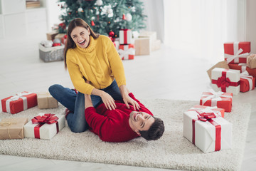 Full size photo of funny funky married people have fun lying on floor laughing enjoy christmas...