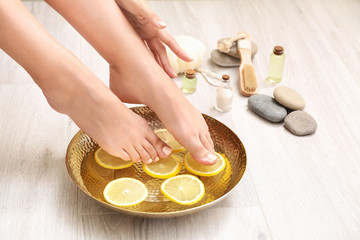 Young woman undergoing spa pedicure treatment in beauty salon © Pixel-Shot
