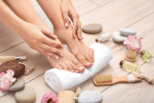 Young woman after spa pedicure treatment in beauty salon