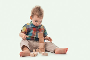 Happy Baby Boy Playing with Toys, Isolated on White Background