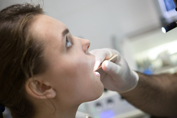 Otolaryngologist examines a young girl