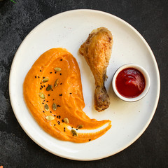 portion of pumpkin and turkey or chicken (festive treat, delicious main course, healthy food) menu concept. food background. copy space. Top view