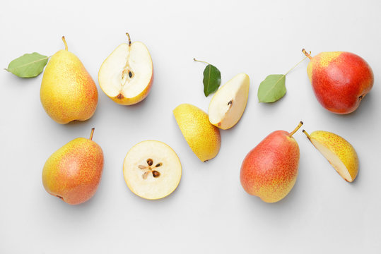 Sweet ripe pears on white background
