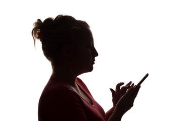 Silhouette girl with a mobile smart phone, using - isolated, technology