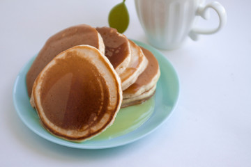 pancakes covered with honey