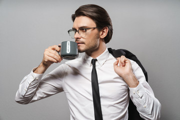 Fototapeta premium Portrait of a handsome young businessman wearing suit