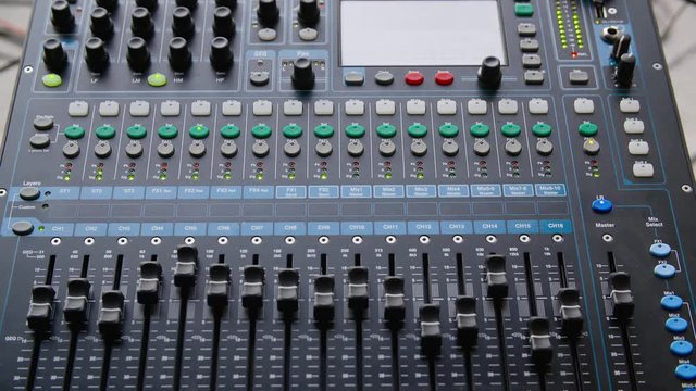 Mixer Console Electrical Sound Studio Closeup. Electronic Soundboard Professional Radio Record Musician Occupation. Knob Panel Button Amplifier Adjustment Music Industry Equipment Concept