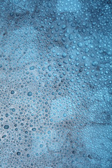 Close up water drops on blue background, Water drop in macro photography