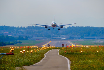 Airplane landing at airport runway
