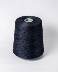 bobbin of yarn on a white background. Side view.Textile reel on isolated white background.