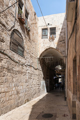 Fototapeta na wymiar The Aqbat e Saraya street leading from the Gate of the Cotton Merchants on the Temple Mount in the Old City in Jerusalem, Israel