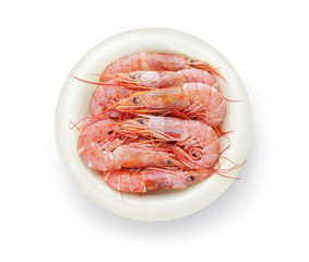 Plate with tasty shrimps on white background