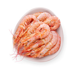Plate with tasty shrimps on white background