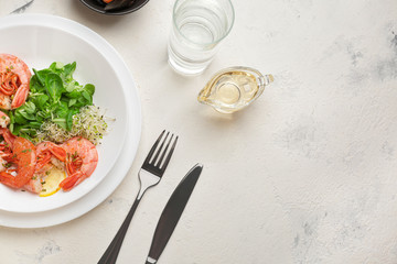 Plate with tasty shrimps on white table
