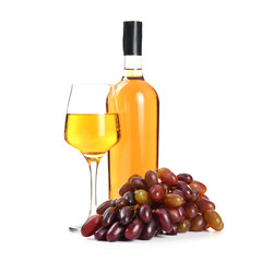 Bottle and glass of tasty wine with grapes on white background