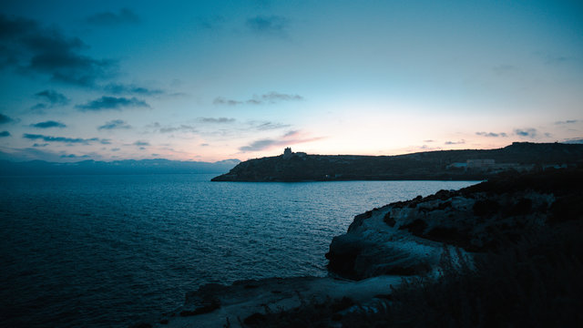 Sunset and view of Calamosca's lighthouse and his coast
